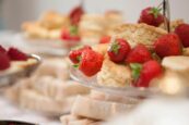 An image of strawberries and scones, included in the best afternoon tea in Sussex