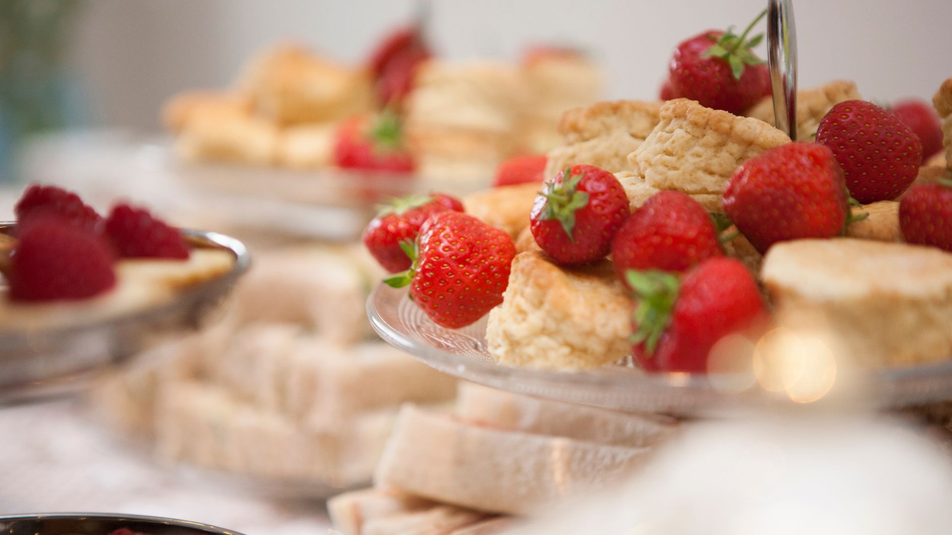 An image of strawberries and scones, included in the best afternoon tea in Sussex