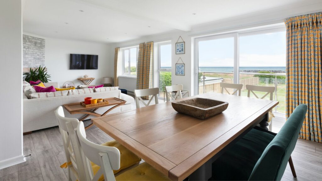 The living room of Braganza - a dog friendly holiday home in Sussex located right on the beachfront. 