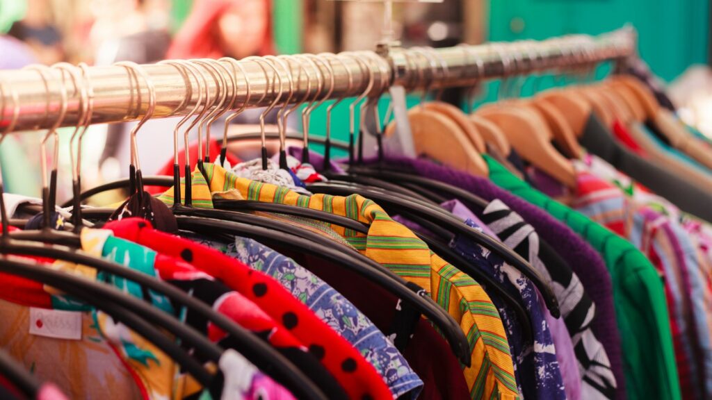 Vintage clothing shops in Brighton, featuring a rail of bright, printed shirts. 