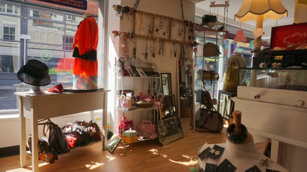 Antique shopping in Brighton. Image features a view inside a shop, facing out to the street. 