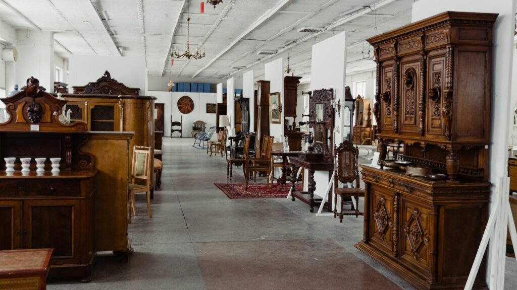 Furniture in a vintage shop in Brighton. Image shows a range of furniture pieces including wardrobes and desks. 