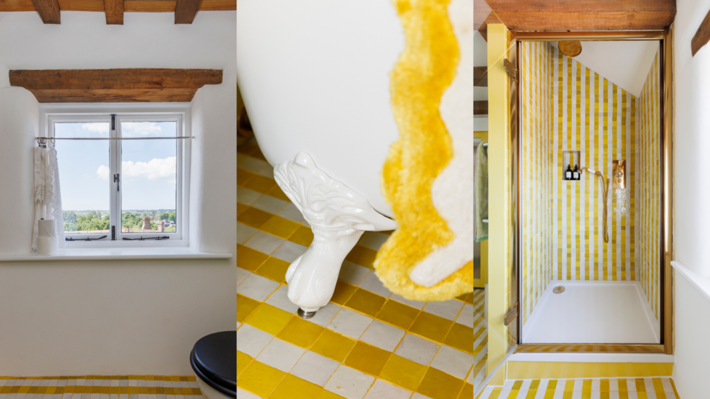 Bright bathroom at 15 Bond Street featuring yellow striped tiles, reclaimed character details, exposed beams and countryside views.